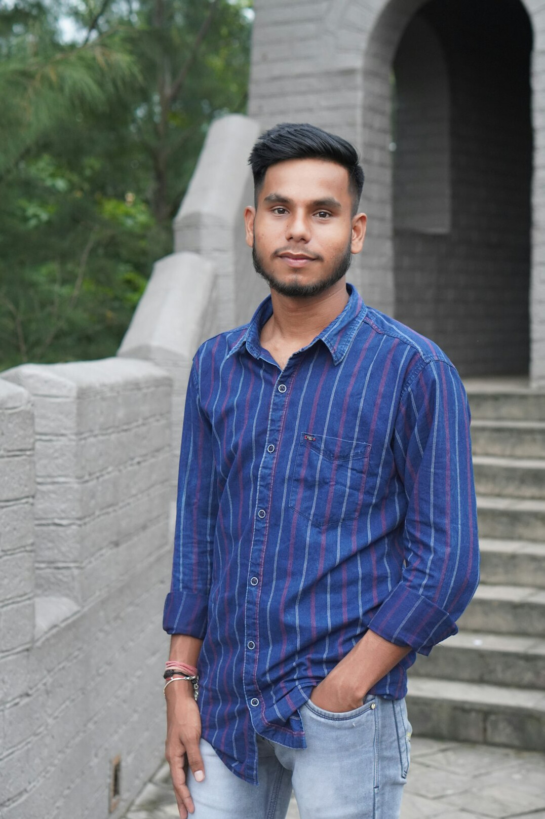 Portrait of a man with short hair in a casual shirt