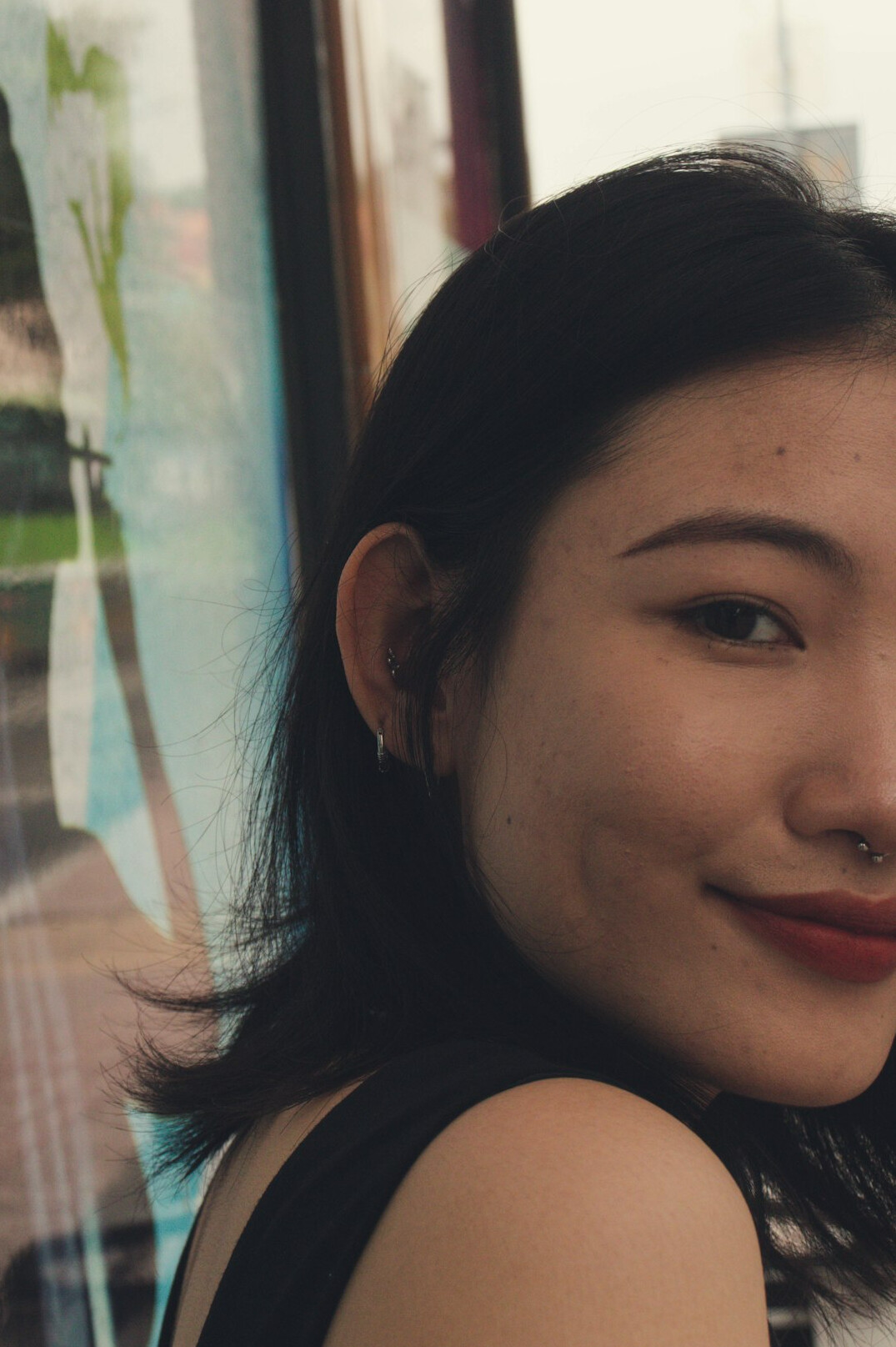 Portrait of a woman with dark hair smiling