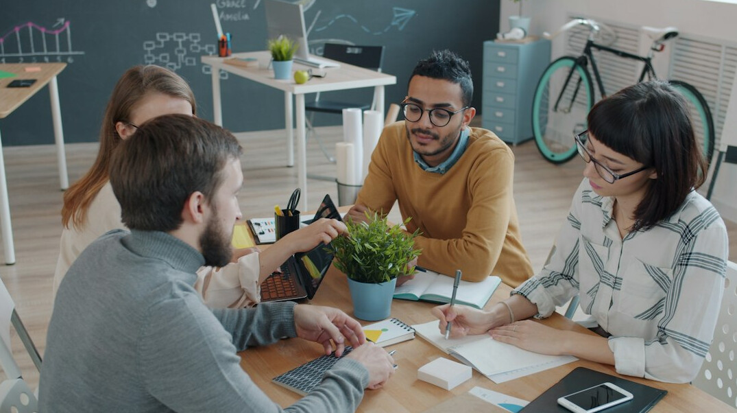 team discussing insurance software